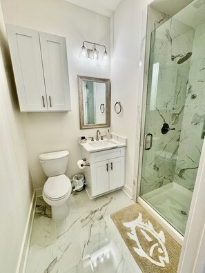 Shower, hair dryer, towels, soap
