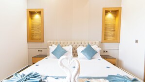 A hotel room with a large bed, two nightstands, and a headboard with a tufted design. - rose garden resort marrakech (Marrakech)
