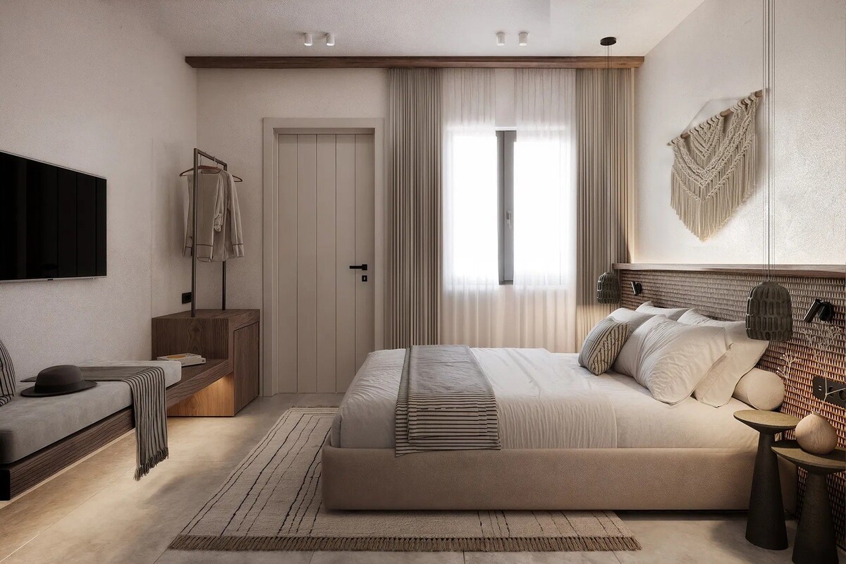Un dormitorio con una cama grande, televisión, armario y escritorio.