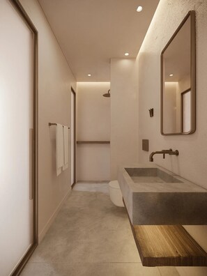 Un baño moderno con un lavamanos grande, un espejo y una ducha.