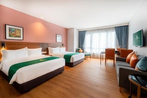 A hotel room with two beds, a sofa, a TV, and a desk. - Arena Premier Hotel (Seremban)