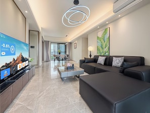 Luxury Suite, Balcony, Ocean View | Living area - Seaside Moments Hotel (Haikou)