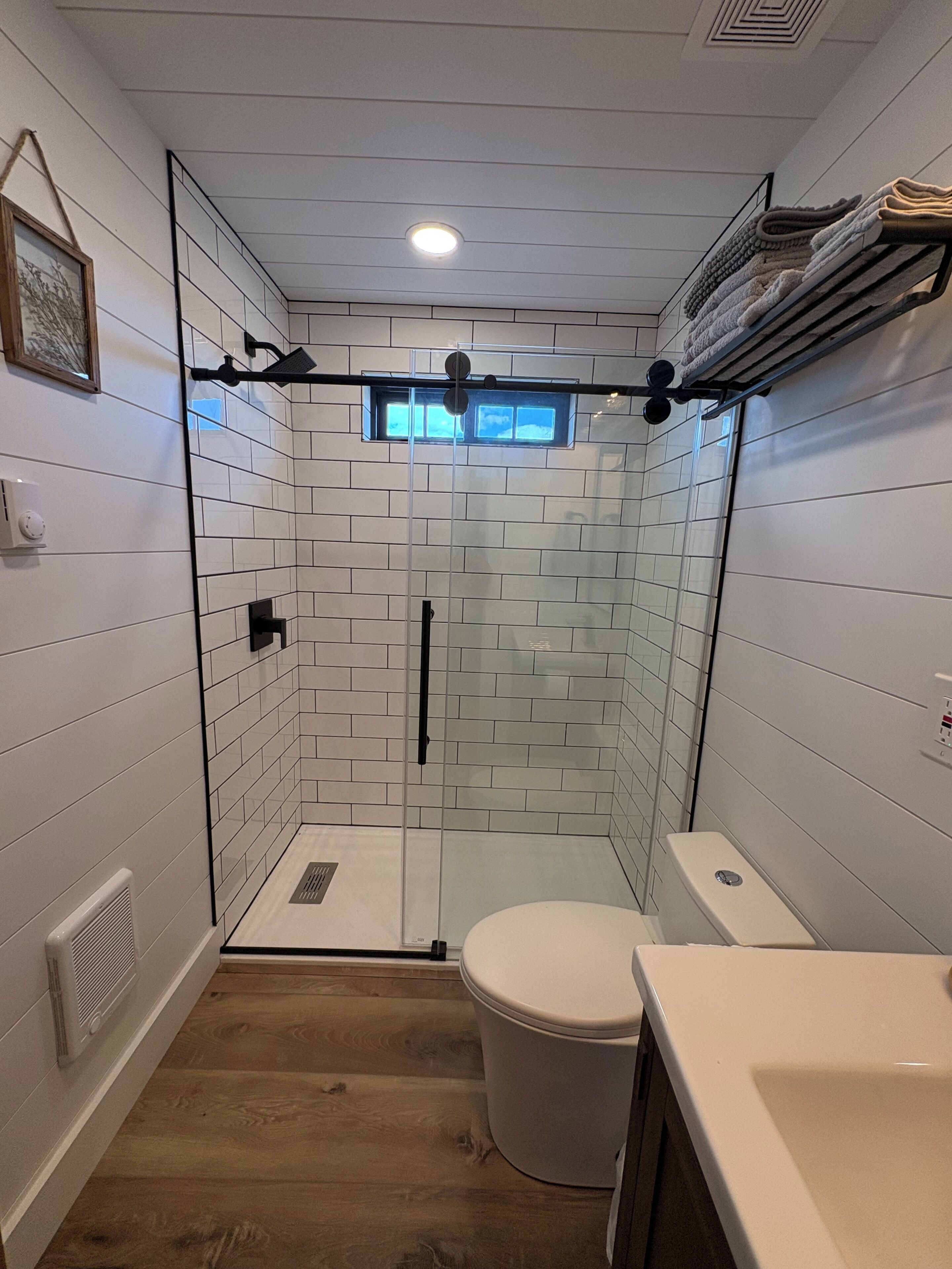 Shower, towels, soap, toilet paper
