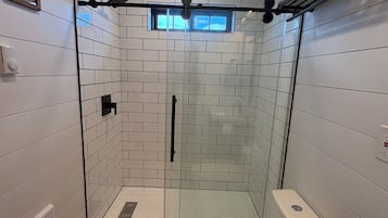Shower, towels, soap, toilet paper