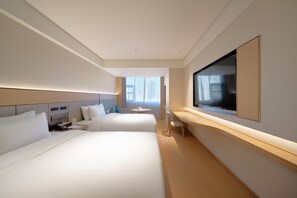A hotel room with two beds, a desk, a TV, and a large window. - JI Hotel Xian Bell Tower North Street Metro Stati (Xi'an)