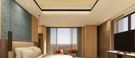 Quarto de hotel moderno com uma cama grande, televisão e vista para a cidade.