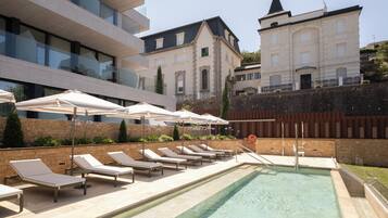 Seasonal outdoor pool, pool umbrellas, pool loungers