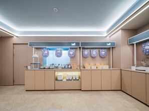A modern kitchen with a central island, wooden cabinets, and a ceiling with recessed lighting. - Hanting Hotel Xian Bell Tower Dachaishi Metro St (Xi'an)