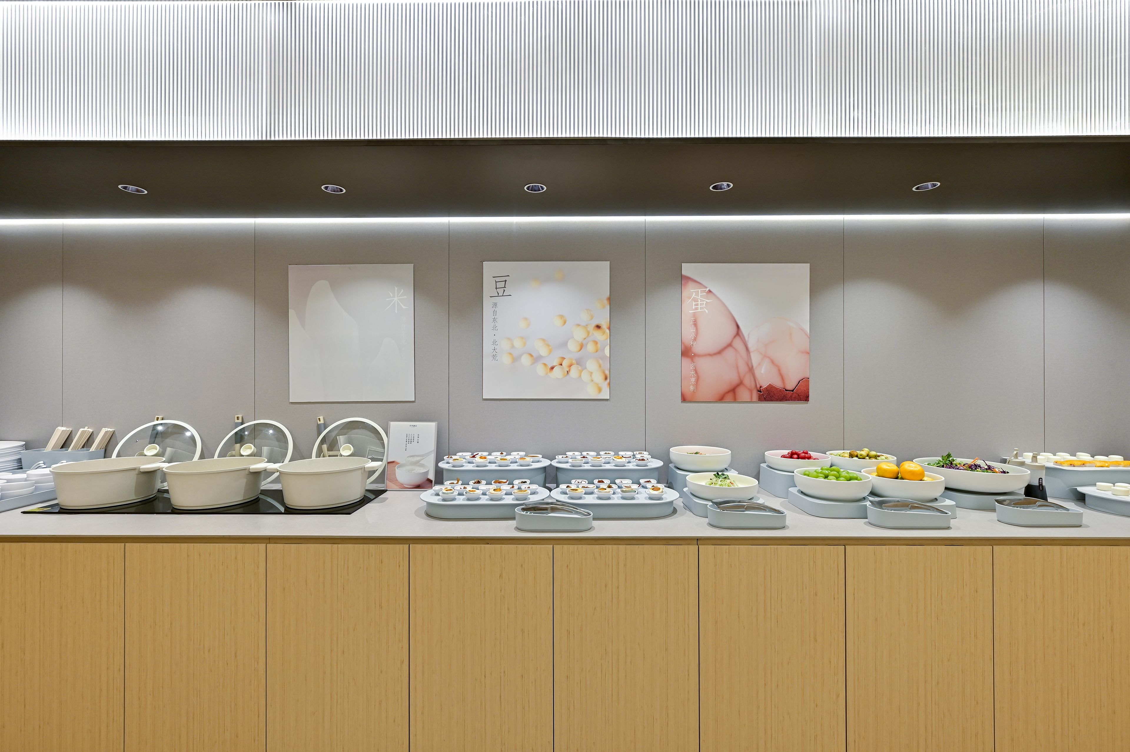 A buffet setup with various food items and bowls.