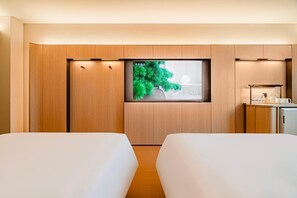 A hotel room with two beds, a large window with a view, and a kitchenette area. - JI Xian Bell Tower Yongning Gate Metro Stat (Xi'an)