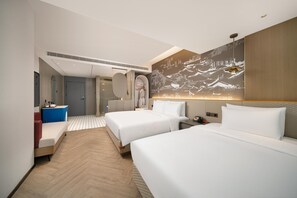 A hotel room with two beds, a sitting area, a bathroom, and a large wall mural. - Meilun Hotel (Xi'an)