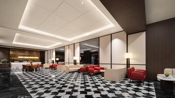 A modern hotel lobby with a checkered floor, seating areas, and a reception desk.