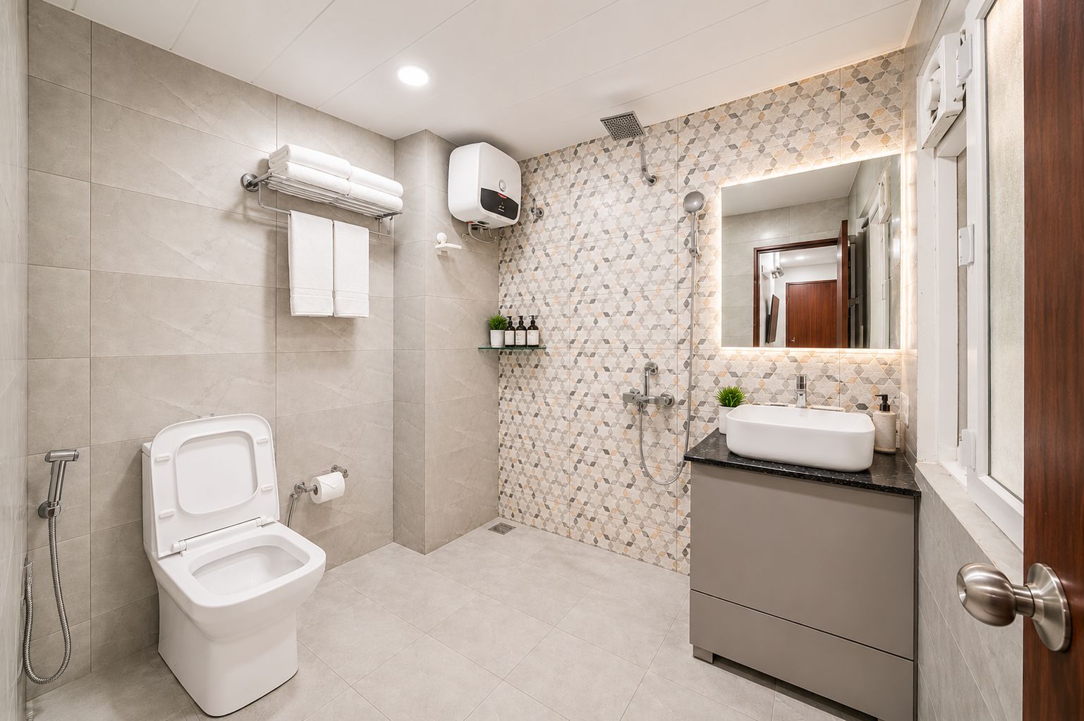 A modern bathroom with a toilet, shower, and vanity.