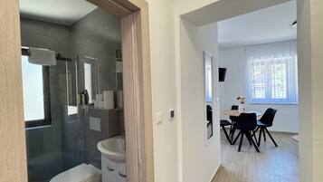 Shower, hair dryer, towels, soap