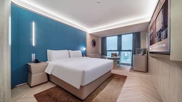 Copriletto in piuma, minibar con snack e bevande gratuite