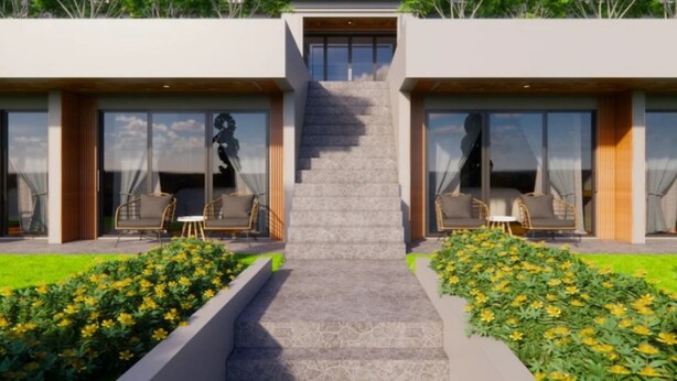A modern two-story house with a central staircase, large windows, and outdoor seating.