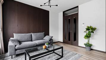 Apartment | Living area | 50-inch flat-screen TV with digital channels