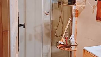 Shower, hair dryer, towels, toilet paper
