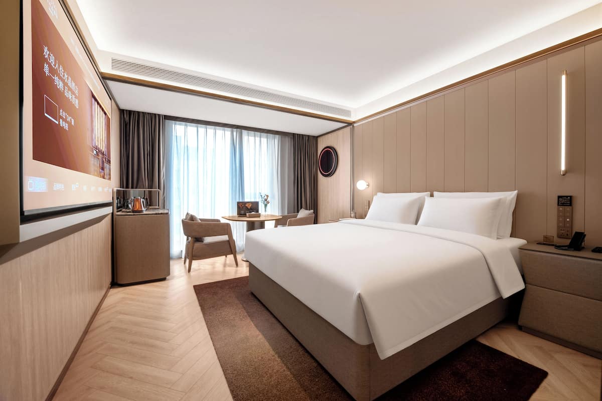 Daunenbettdecken, Betten mit Memory-Foam-Matratzen, kostenlose Minibar