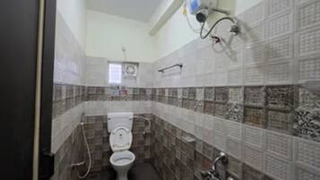 Shower, rainfall showerhead, towels, toilet paper