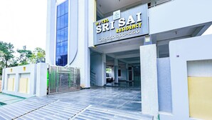 A hotel entrance with a sign reading 'Hotel Srisail Residency.' - Fabhotel Ssr (Khammam)