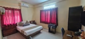 Deluxe Room | Egyptian cotton sheets, premium bedding, in-room safe, desk - Fabhotel Himalay Guest House Saanvi Residency (Pune)