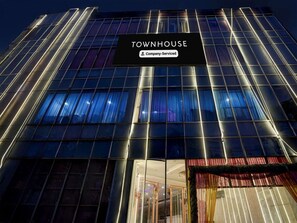 A modern building with a sign reading 'TOWNHOUSE Company-Serviced.' - Saver Double Patparganj Near Max (New Delhi)