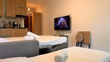 1 slaapkamer, een strijkplank/strijkijzer, wifi, beddengoed