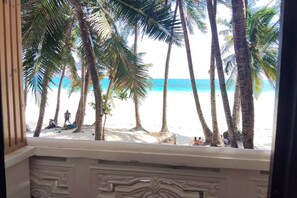 A view of a beach with palm trees and people. - Shenna's Beach Resort Boracay (Boracay Island)