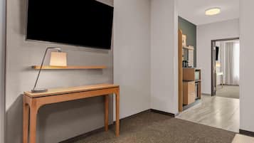 Premium bedding, desk, laptop workspace, blackout drapes
