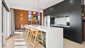 Coffee/tea maker, fridge, microwave, oven