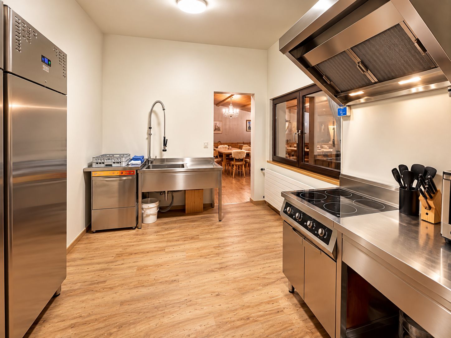 A modern kitchen with stainless steel appliances, a dishwasher, and a stove.