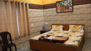 Chambre Deluxe | Lits pliants/supplémentaires, draps fournis