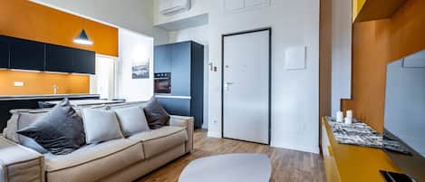 Apartment, 3 Bedrooms, 2 Bathrooms | Living area | 55-inch flat-screen TV with digital channels