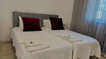 2 dormitorios, tabla de planchar con plancha, Internet y ropa de cama