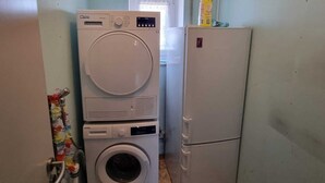 A laundry room with a washing machine, dryer, and refrigerator. - Just like home, D3 OG? (Kreßberg)