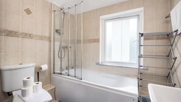 Shower, hair dryer, towels, toilet paper