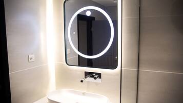 Shower, towels, soap, toilet paper