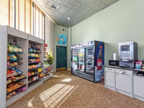A vending area with snacks, a Dr. Pepper machine, and a microwave. - Escape to the cool mountain air and breathtaking views (Sugar Mountain)