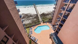 A high-rise building with a pool, beach view, and balconies. - Four Seasons 804E by Liquid Life (Orange Beach)