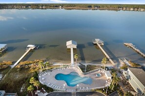 An aerial view of a resort with a central pool, connected docks, and a surrounding landscape. - Mustique 1401 by Liquid Life (Gulf Shores)