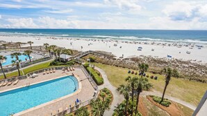 A resort with a swimming pool, beach access, and palm trees. - Seaside Beach & Racquet 4608 by Liquid Life (Orange Beach)