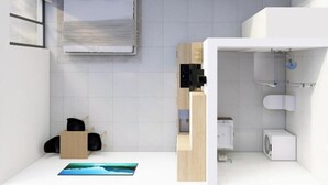 Ein modernes, kleines Hotelzimmer mit Bett, einer Küchenzeile, einem Badezimmer und Meerblick.