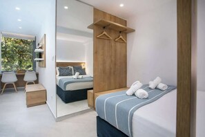 A modern bedroom with a bed, a desk, and a mirror. - Elegant Blue Rhodes Center Apartment Near the Sea (Rhodes)