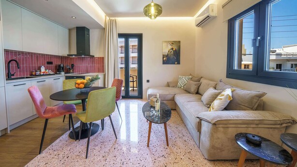 A modern living space with a kitchen, dining area, and seating area. - Noble Heraklion Suites Terra Suite in Crete (Heraklion)