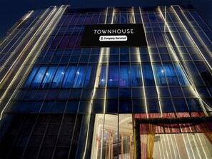 A modern building with a sign reading 'TOWNHOUSE Company-Serviced.' - Deluxe Patparganj Near Max Hospital (New Delhi)