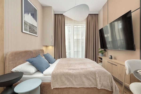 Relax in the stylish living room with a comfortable sofa and modern decor.