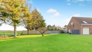 A residential property with a well-maintained lawn, a detached brick house, and a garage. - 2 Bed in Duddlestone (oc-q34588) (Duddlestone)
