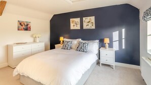 A bedroom with a bed, two bedside tables, a dresser, and wall art. - 3 Bed in Cundall (oc-l34088) (Cundall)