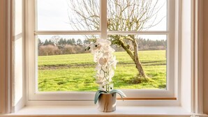 A window with a view of a green field and a tree. - 3 Bed in Cundall (oc-l34088) (Cundall)